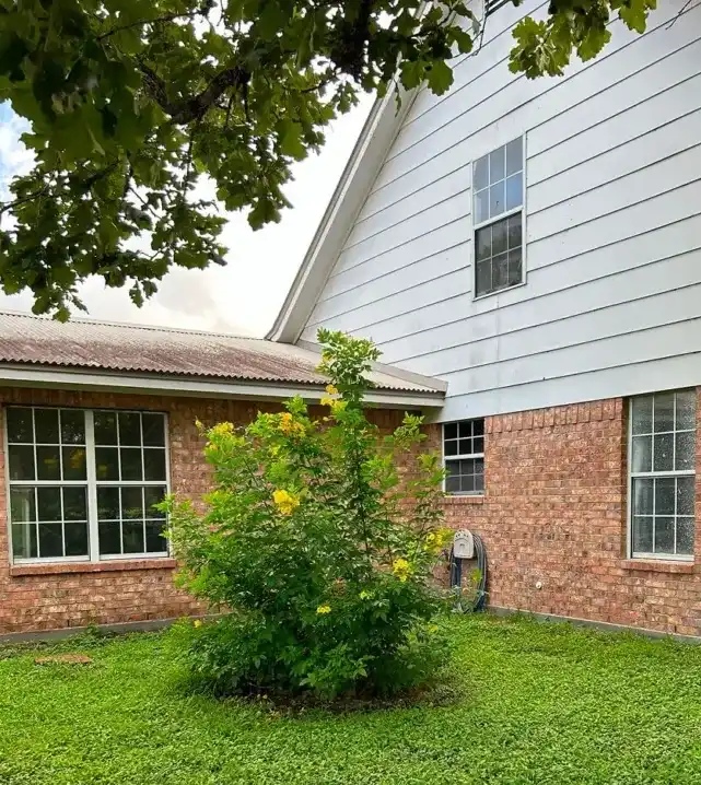 Windows with grids shown before renovation or replacement.